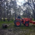 tractor pulling spike roller